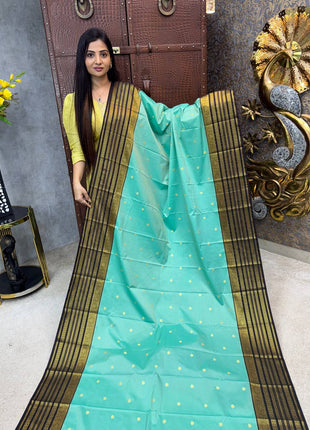 Vaira Oosi Golden Zari With Coffee Brown Border
