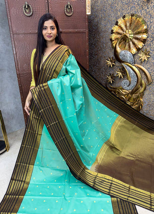 Vaira Oosi Golden Zari With Coffee Brown Border